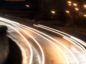 The headlights of passing vehicles create long lines of light in this eight second exposure captured from Portage Avenue looking south at northbound traffic.