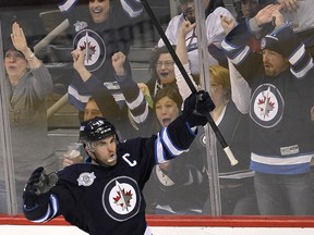 Fans cheer as Winnipeg Jets left winger Andrew Ladd celebrates his first period goal against the New Jersey Devils at MTS Centre on Jan 14. (BRIAN DONOGH/Winnipeg Sun files)