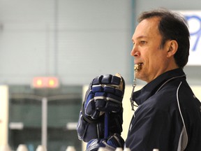 Senators forward Nick Foligno has turned to his father Mike, shown during his time as an assistant coach with Anaheim, for advice on breaking out of his scoring slump. (Gino Donato/QMI Agency file photo)