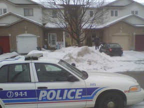 Ottawa Police are investigating a report of gunshots in this townhome complex near 3400 Southgate Rd. in the South Keys neighbourhood before 11 a.m. on Wednesday, Feb. 15, 2012. (ERROL McGIHON Ottawa Sun)