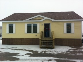 This cheerful-looking yellow bungalow is an example of the homes that several dozen Lake St. Martin First Nation residents have chosen to move into at a temporary site near the flooded reserve. As of Feb. 15, 43 families of evacuees have chosen to live in the homes, which vary in size and cost on average $160,000, the province said. (TAMARA KING/Winnipeg Sun)
