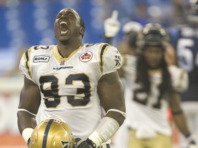 Defensive lineman Don Oramasionwu (celebrating after sacking Toronto quarterback Dalton Bell in the dying seconds of Winnipeg's 33-24 victory over the Argos in Toronto on July 24, 2011) signed with the Edmonton Eskimos on Wednesday, Feb.15, 2012 as a free agent. (JACK BOLAND/QMI Agency Files)
