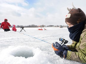 Jordyn Winger, 10, is bundled up from the cold during the 2nd annual Bridgenorth Winter Panfish Festival on Chemong Lake on Feb. 19, 2011. CLIFFORD SKARSTEDT/QMI Agency