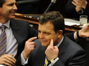 FInance Minister Dwight Duncan was all smiles when he delivered the Liberals’ 2011 budget last March. 
MICHAEL PEAKE/TORONTO SUN