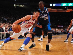 New York Knicks point guard Jeremy Lin, left, drives to the basket past Dallas Mavericks guard Dominique Jones in the second half of their NBA basketball game at Madison Square Garden in New York, Feb. 19, 2012. (REUTERS/Adam Hunger)