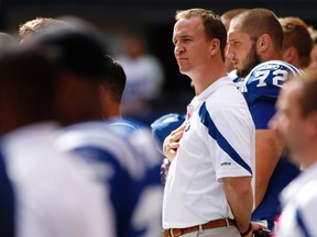 Indianapolis Colts quarterback Peyton Manning stands at attention during the national anthem prior to the Colts' NFL football game against the Kansas City Chiefs in Indianapolis Oct. 9, 2011. (REUTERS/Brent Smith)