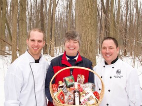 Eric Boyar (left), owner/chef at Six Thirty Nine, and Michael Davies, executive chef at the Elm Hurst Inn and Spa, with Mary Jakeman picking up maple syrup for their special March menus. (Handout – Oxford Tourism)