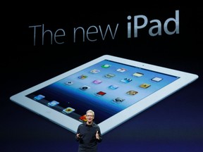 Apple CEO Tim Cook introduces the new iPad during an Apple event in San Francisco March 7, 2012. REUTERS/Robert Galbraith