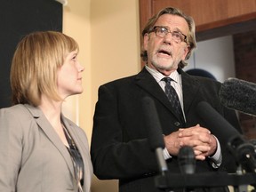 Attorney John Henry Browne (R) and partner attorney Emma Scanlon (L) speak to the media about the U.S. soldier linked to the killing of 16 Afghan civilians, in their Seattle, Washington offices on March 15, 2012. (REUTERS/Anthony Bolante)