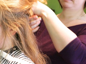 Hairdressers in the U.K. are being urged to learn how to spot skin cancer signs on their clients. (QMI Agency files)
