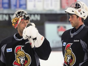 Senators goalies Alex Auld (left) and Ben Bishop chat during practice at the Bell Sensplex on Wednesday. (Tony Caldwell, Ottawa Sun)