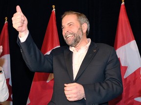 Newly elected New Democratic Party (NDP) Leader Thomas Mulcair gestures as he meets with his new caucus in Toronto March 25, 2012. Mulcair succeeds former NDP Leader Jack Layton who passed away last summer.  REUTERS/Mike Cassese