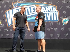 John Cena and Dwayne 'The Rock' Johnson face off at the press conference for WrestleMania XXVIII at the Eden Roc Renaissance in Miami Wednesday, March 26, 2012. (WENN.com)