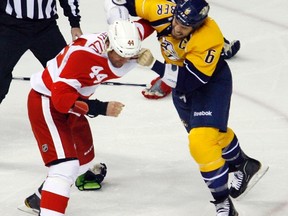 Detroit Red Wings right wing Todd Bertuzzi, left, fights with Nashville Predators defenseman Shea Weber in the first period during Game 2 of their NHL Western Conference quarterfinal hockey playoffs in Nashville, Tennessee April 13, 2012. (REUTERS/M. J. Masotti Jr.)
