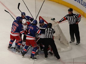 The Ottawa Senators took on the New York Rangers during the second game of their playoff series at Madison Square Gardens in New York City Saturday April 12, 2012.  Ottawa Senators and the New York Rangers mix it up during first period action Saturday night in New York.    Tony Caldwell/Ottawa Sun/QMI Agency