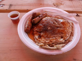 THE MAIN ATTRACTION: Maple syrup over pancakes under the dining tent at the Paris Lions Club Maple Syrup Festival in downtown Paris, Ontario on Saturday, April 14, 2012. MICHAEL PEELING/THE PARIS STAR/QMI AGENCY