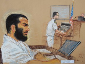 A drawing by artist Janet Hamlin, reviewed by the U.S. military, shows young Canadian captive, Omar Khadr, who is accused of throwing a grenade that killed a U.S. soldier in Afghanistan in July 2002, as his lead defense counsel, Navy Lieutenant Commander William Kuebler, addresses the judge, Army Colonel Pat Parrish at a pre-trial session at the Guantanamo Bay naval base December 12, 2008. (REUTERS/Janet Hamlin/Pool)