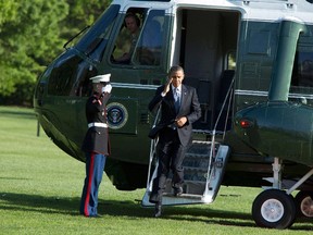 U.S. President Barack Obama steps from the Marine One helicopter as he returns to the White House in Washington April 25, 2012.    REUTERS/Joshua Roberts