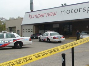 An employee was shot Thursday morning during a robbery by three men at Humberview Motor Sports on Bloor St. W. near Jane St. (KEVIN CONNOR/Toronto Sun)