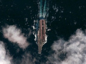 China’s new aircraft carrier Shi Lang - seen here on her first Pacific trials - is a cheap, low-risk way to get experience operating the modern equivalent of a capital ship (REUTERS).