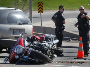 Ottawa Police shown here at the scene of a crash between a mini van and motorcycle on St. Laurent Blvd. in Ottawa Saturday May 5, 2012. 
(Tony Caldwell/Ottawa Sun/Postmedia Network)