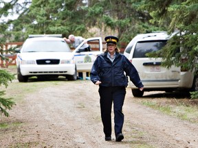 Constable Barb Roy prepares to speak to the media after a man and a woman were discovered dead in a property near RR 271 and TWP 515 outside of Spruce Grove Saturday.  The deaths have been ruled suspicious and are under investigation. AMBER BRACKEN/EDMONTON SUN/QMI AGENCY