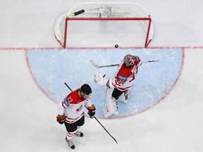 Canada's goalkeeper Cam Ward (reacts next to his teammate Marc Methot after failing to save the winning goal of Paul Stastny of the U.S. in the overtime of their 2012 IIHFWorld Championship game in Helsinki 
Saturday.
Grigory Dukor, Reuters