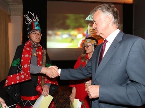 Enbridge CEO Patrick Daniel shakes hands with Chief Na’Moks of the Wet’suwet’en Nation before the start of Enbridge's annual general meeting for shareholders in Toronto Wednesday May 9, 2012. (Craig Robertson/Toronto Sun)