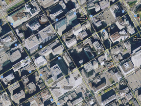 The City of Ottawa's emphasis on "infill" construction and allowing large condo and office tower developments is pushing downtown infrastructure to the brink of collapse, says the owner of the Bell Place tower at 160 Elgin St. -- shown with the red pointer A at lower right. (Google Maps image)