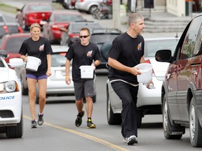 Up to 30 people participate in the 25th annual Torch Run on North Front Street in Belleville Tuesday morning.