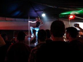 A stripper performs during a show at Greece's Athens Erotic Dream sex fair at a suburb of Athens May 25, 2012. Greece's once-thriving sex industry has become the latest victim of the country's debt crisis as Greeks spend less on erotic toys, pornography and titillating underwear. REUTERS/Yorgos Karahalis