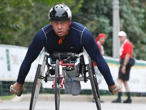 Michel Filteau cruises to victory in the wheelchair race on Sunday. (Tony Caldwell, Ottawa Sun)