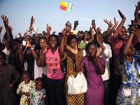 A crowd cheers as Pope Benedict XVI approaches in Benin's main city Cotonou, November 19, 2011. REUTERS/Finbarr O'Reilly