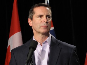 Ontario Premier Dalton McGuinty speaks to reporters in Niagara Falls on Nov. 26, 2011 at the Liberal Party's provincial council meeting at the Scotiabank Convention Centre. (QMI Agency/Brett Clarkson)