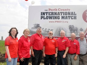 IPM 2013 executive members Coralee Foster (left), Dianne Josling, Bert Vorstenbosch, Larry Cook, Ron McKay and Laverne Gordner pose after the IPM 2013 sign was unveiled east of Mitchell on Saturday, June 9. Also part of the photo was MP Gary Schellenberger and MPP Randy Pettapiece (right).