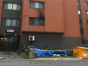 Ottawa firefighters helped evacuate this apartment complex, then doused the flames in a second-storey apartment late on Monday, June 11, 2012. (MARLO CAMERON Ottawa Sun)