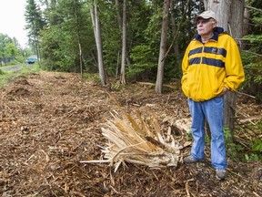 Stittsville's Harris Sinclair is frustrated with the removal of trees behind his property. Tuesday June 12, 2012. (ERROL MCGIHON/OTTAWA SUN).