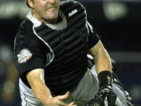 Catcher Mike Redmond with the Florida Marlins July 20, 2004. (Reuters files)