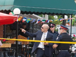 Police investigate after this week's fatal shooting in Little Italy. (JACK BOLAND, Toronto Sun)