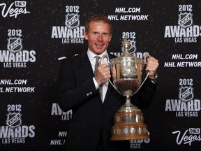 Daniel Alfredsson holds the King Clancy Memorial Trophy after the NHL awards ceremony in Las Vegas. (Bruce Bennett/Getty Images/AFP)