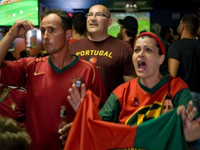 Portugal fans show their pain at the Red Cherry Bar & Grill on Dundas St. West as their team was shown the exit at Euro 2012 (Dave Thomas/Toronto Sun/QMI Agency).