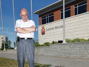R.J. Butt, Director Outreach of the Royal Canadian Legion, stands beside a broken inukshuk outside Legion House in Ottawa Thursday, June 28, 2012. The inukshuk was knocked over and damaged, angering legion officials and the family of fallen soldier Marc Leger.
(QMI AGENCY/Tony Caldwell)