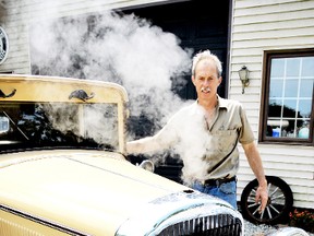 DIANA MARTIN diana.martin@sunmedia.ca

Stan Uher, of Blenheim, is shrouded in steam after uncapping the radiator on 1930s Buick Thursday. Uher said the high temperatures were not helping him figure out what was making the heritage vehicle overheat.