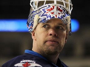 The Jets will have to decide Sunday whether to bring back veteran goalie Chris Mason to play the back-up position, sign Jonas Gustavsson to a deal, or let them both go to free agency.(Marianne Helm/GETTY IMAGES/AFP)