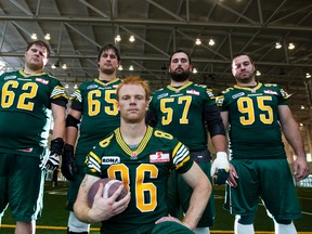 The Edmonton Eskimos lineup includes five of the top 11 picks from the 2009 draft: from left, Dylan Steenbergen (seventh overall), Simeon Rottier (first), Matt Carter (fifth), Gord Hinse (11th) and Etienne Legare (second) pose after practice at the Commonwealth Stadium fieldhouse on Wednesday. (Amber Bracken, Edmonton Sun)