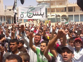 Demonstrators gather as they protest against Syria's President Bashar al-Assad at Binsh near Idlib July 6, 2012.  REUTERS/Shaam News Network/Handout