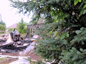 Three bodies were discovered Tuesday, July 10, 2012, in the garage of a residence in Warwick,Que. after a fire.
(QMI AGENCY)