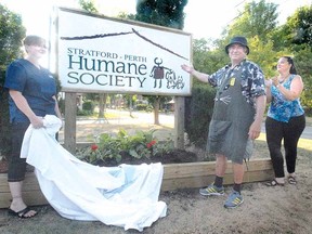 SCOTT WISHART The Beacon Herald
Shown at an unveiling of the new Stratford-Perth Humane Society sign are, from left, general manager Sarah Tickner, advisory council chair Larry Baswick and Linda Hoffman, board chair of the Kitchener-Waterloo Humane Society. The new sign was part of a celebration marking the merger of the Stratford-Perth and K-W Humane Societies.