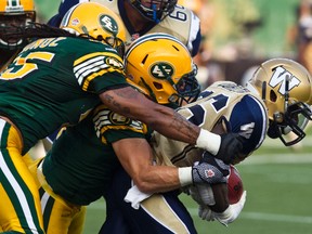 Bombers RB Bloi-Dei Dorzon is taken down during a game against the Eskimos. (Codie Mclachlan/QMI AGENCY/FILE PHOTO)