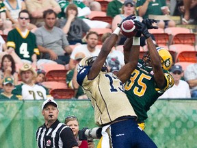 Bombers WR Chris Matthews jumps to make a spectacular catch during Friday's game against the Eskimos. Through three games, Matthews leads the CFL in receiving with 320 yards.